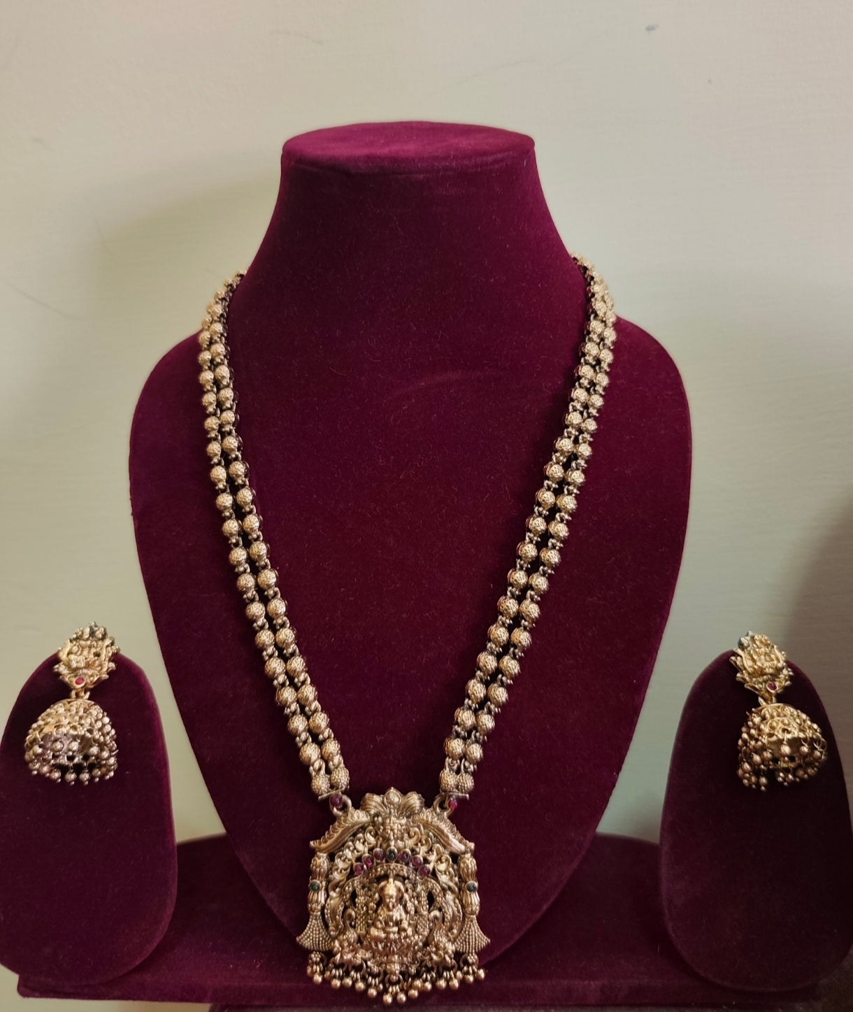 Gold bead god maalai