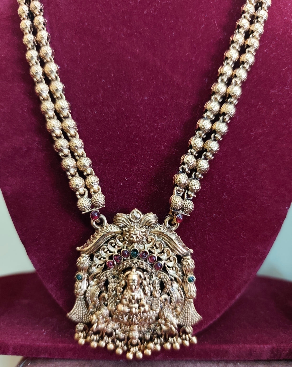 Gold bead god maalai